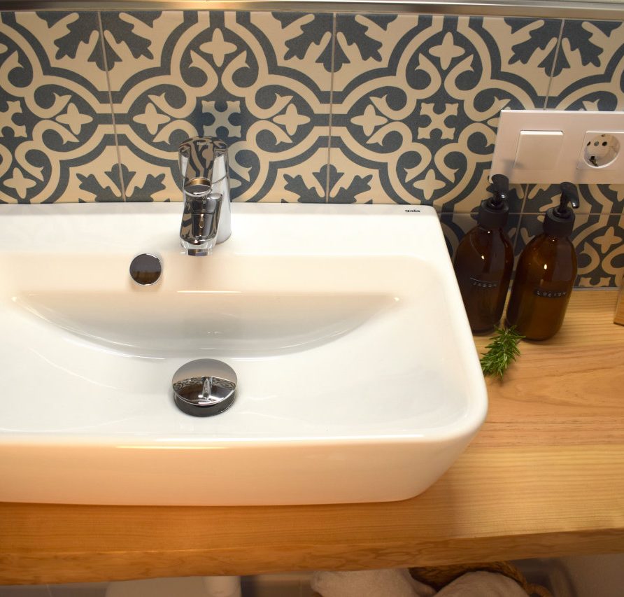 close up of sink with Moorish tiles